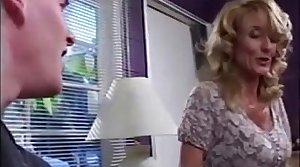 Busty mommy fucks young boy while dad is away